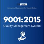 Blue background graphic displaying ISO Xpert branding with the text 'International Organization for Standardization 9001:2015 Quality Management System' and an icon of a hand holding a ribbon badge with a check mark